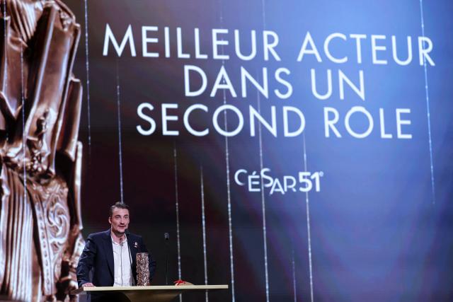 French actor Pierre Lottin delivers a speech with his trophy after winning the Best Actor in a Supporting Role award for The The Stranger (L'Etranger) during the 51st edition of the Cesar Film Awards ceremony at the Olympia venue in Paris on February 26, 2026. (Photo by Thomas SAMSON / AFP)