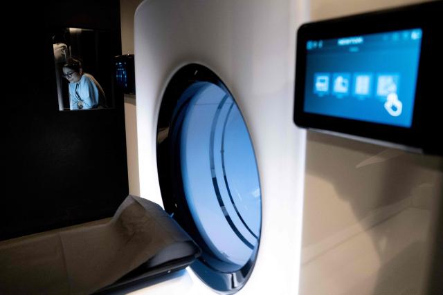 Laura, a medical radiology technician, works inside the 'Cone Beam Computed Tomography' (CBCT) room at Zoi's medical centre, a start-up offering personalised medical check-ups in Paris on February 24, 2026. (Photo by Anna KURTH / AFP)