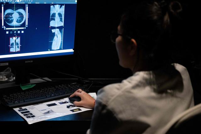 Laura, a medical radiology technician, works inside the 'Cone Beam Computed Tomography' (CBCT) room at Zoi's medical centre, a start-up offering personalised medical check-ups in Paris on February 24, 2026. (Photo by Anna KURTH / AFP)