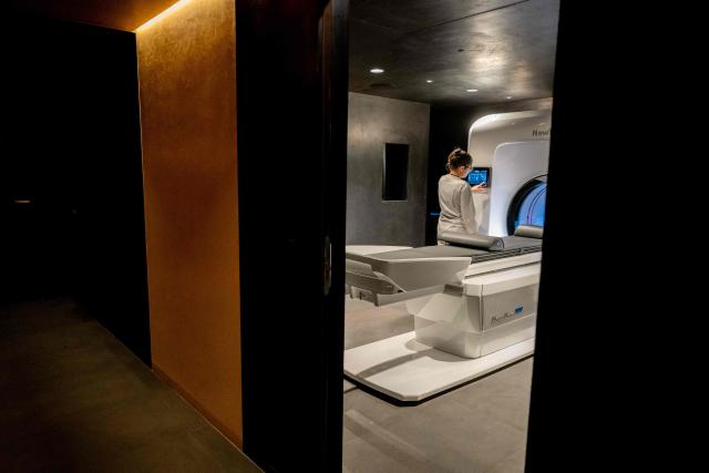 Laura, a medical radiology technician, works inside the 'Cone Beam Computed Tomography' (CBCT) room at Zoi's medical centre, a start-up offering personalised medical check-ups, in Paris on February 24, 2026. (Photo by Anna KURTH / AFP)