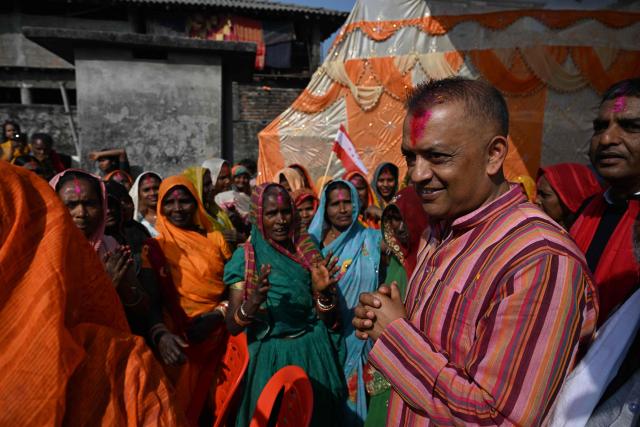 (FILES) Nepali Congress party's president and election candidate Gagan Thapa greets supporters during door-to-door campaign in Sarlahi on February 21, 2026. Supporters chant the name of Gagan Thapa as he campaigns in Nepal's first election since deadly youth-led protests toppled the government, presenting himself as the face of generational change. (Photo by PRAKASH MATHEMA / AFP)