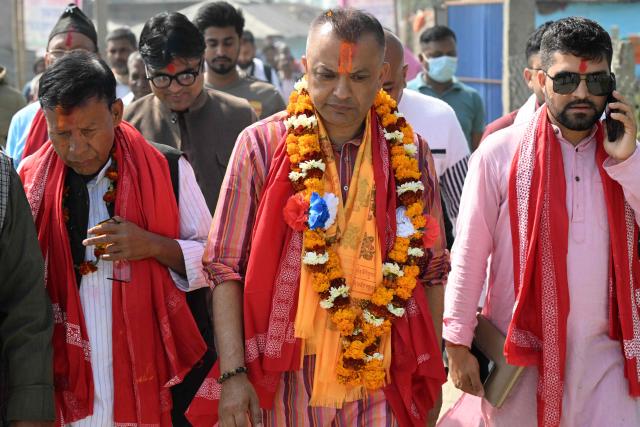 (FILES) Nepali Congress party's president and election candidate Gagan Thapa (C) walks during a door-to-door campaign in Sarlahi on February 21, 2026. Supporters chant the name of Gagan Thapa as he campaigns in Nepal's first election since deadly youth-led protests toppled the government, presenting himself as the face of generational change. (Photo by PRAKASH MATHEMA / AFP)
