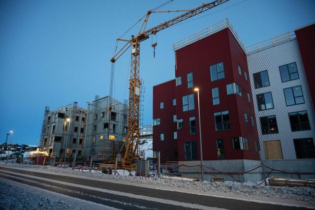 This photograph shows an under-construction residential building stands in Nuuk, Greenland, on February 26, 2026. Greenland’s economy is primarily focused on fishing, but with the United States’ growing interest in the country, its prospects appear to be diversifying. However, specialists warn that this could lead to economic imbalance for the Arctic island. (Photo by Florent VERGNES / AFP)