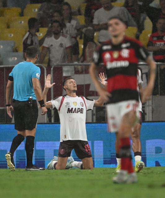 Lanus' midfielder #19 Rodrigo Castillo celebrates after scoring his team's first goal during the Recopa Sudamericana second leg final football match between Brazil's Flamengo and Argentina's Lanus at the Maracana Stadium in Rio de Janeiro, Brazil, on February 26, 2026. (Photo by MAURO PIMENTEL / AFP)