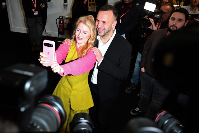 Green Party candidate Hannah Spencer poses for a selfie with Green Party leader Zack Polanski after winning the Gorton and Denton Parliamentary by-election, at Manchester Central Convention Complex in Manchester, northern England on February 27, 2026. Britain's ruling Labour party on Friday lost a crunch local poll in one of its traditional heartlands to the left-wing Greens, official results showed, adding to the woes of unpopular Prime Minister Keir Starmer. (Photo by Paul ELLIS / AFP)