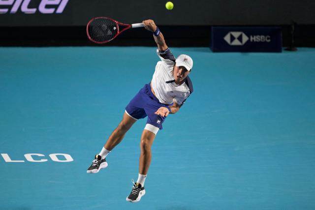 USA's Brandon Nakashima serves to Monaco's Valentin Vacherot during the 2026 Mexico ATP 500 Tennis Open men's singles match at the Arena GNP Seguros in Acapulco, Guerrero State, Mexico, on February 26, 2026. (Photo by Alfredo ESTRELLA / AFP)