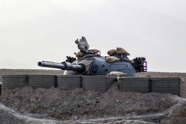 A Pakistani army tank stands at the Pakistan-Afghanistan border in Chaman on February 27, 2026, following overnight cross-border fighting between the two countries. Pakistan bombed major cities in Afghanistan including the capital Kabul on February 27, with Islamabad's defence minister declaring the neighbours at "open war" following months of tit-for-tat clashes. AFP journalists in Kabul and Kandahar heard blasts and jets overhead, as Pakistan launched air strikes on the Afghan capital and southern power base of the Taliban authorities. (Photo by Abdul BASIT / AFP)