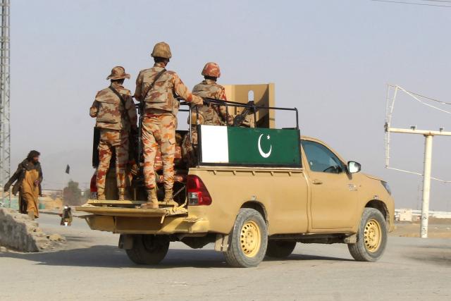 Pakistani soldiers patrol near the PakistanAfghanistan border crossing in Chaman on February 27, 2026, following overnight cross-border fighting between the two countries. Pakistan bombed major cities in Afghanistan including the capital Kabul on February 27, with Islamabad's defence minister declaring the neighbours at "open war" following months of tit-for-tat clashes. AFP journalists in Kabul and Kandahar heard blasts and jets overhead, as Pakistan launched air strikes on the Afghan capital and southern power base of the Taliban authorities. (Photo by Abdul BASIT / AFP)