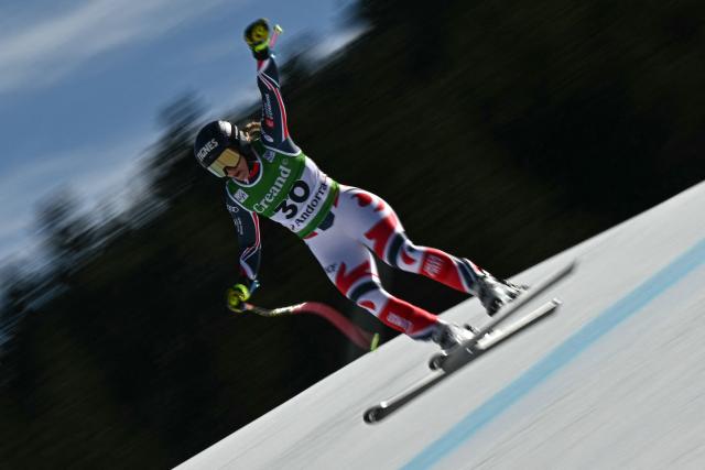 This slow shutter speed photograph shows France's Laura Gauche competing in the women's downhill race, part of the FIS Alpine Ski World Cup 2025-2026 in Soldeu, Andorra on February 26, 2026. (Photo by Lionel BONAVENTURE / AFP)