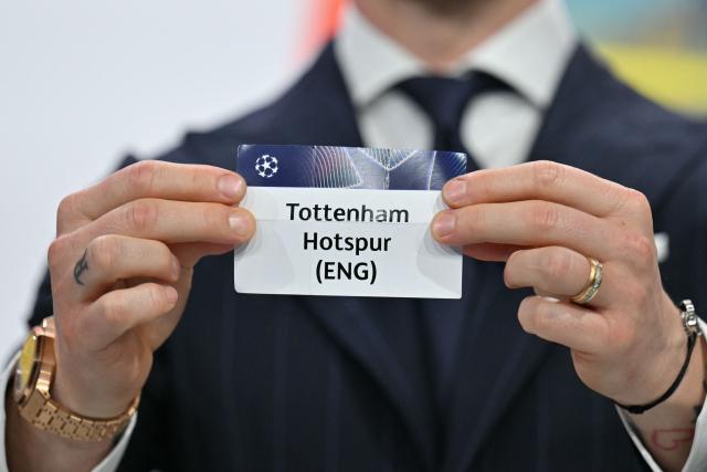 UEFA Foundation for Children ambassador and former Sevilla midfielder, Ivan Rakitic holds up the slip of Tottenham Hotspur (ENG) during the 2025-2026 UEFA Champions League round of 16, quarter-final and semi-final draw at the House of European Football in Nyon, western Switzerland on February 27, 2026. (Photo by Harold CUNNINGHAM / AFP)