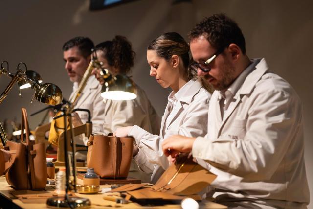 Artisans work on creations for the Italian brand Tod's before its collection show at Milan's Fashion Week Womenswear Fall / Winter 2026/2027, in Milan on February 27, 2026. (Photo by MIGUEL MEDINA / AFP)