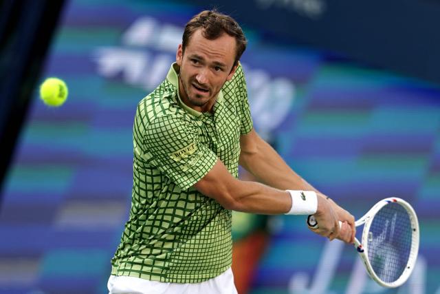 Russia’s Daniil Medvedev hits a return against Canada's Felix Auger-Aliassime in the men’s singles semi-final match at the Dubai Duty Free Tennis tournament in Dubai on February 27, 2026. (Photo by Fadel SENNA / AFP)