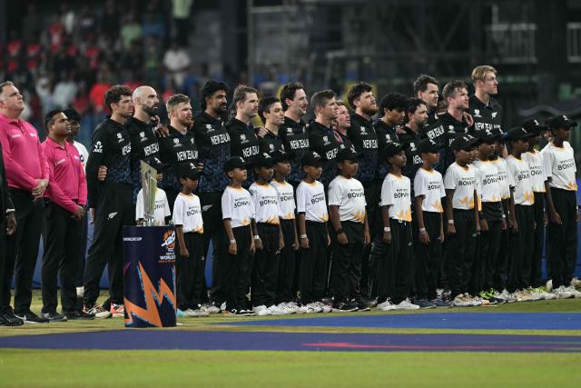 New Zealand's players stand for their national anthem at the start of the 2026 ICC Men's T20 Cricket World Cup Super Eights match between England and New Zealand at the R Premadasa Stadium in Colombo on February 27, 2026. (Photo by Ishara S. KODIKARA / AFP)