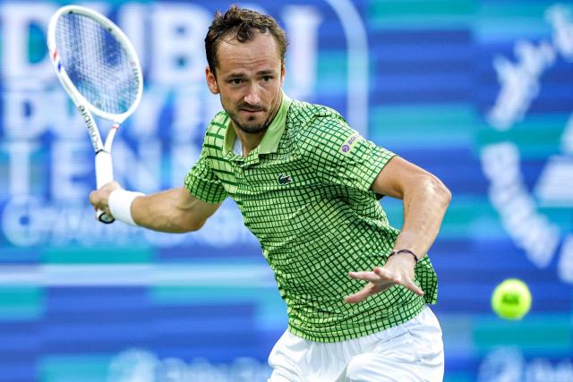 Russia’s Daniil Medvedev returns a shot during his men’s singles semi-final match against Canada's Felix Auger-Aliassime at the Dubai Duty Free Tennis tournament in Dubai on February 27, 2026. (Photo by Fadel SENNA / AFP)