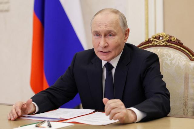 In this pool photograph distributed by the Russian state agency Sputnik, Russia's President Vladimir Putin chairs a Security Council meeting via videolink in Moscow on February 27, 2026. (Photo by Gavriil GRIGOROV / POOL / AFP)