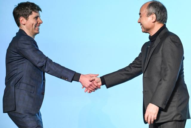 (FILES) OpenAI CEO Sam Altman (L) and SoftBank group Chairman and CEO Masayoshi Son shake hands during a talk session in Tokyo on February 3, 2025. OpenAI announced on February 27, 2026, a massive $110 billion funding round valuing the ChatGPT maker at $730 billion, with SoftBank, Nvidia and Amazon each making multi-billion dollar commitments as the artificial intelligence company races to meet surging global demand. The investment round -- one of the largest in Silicon Valley history -- includes $30 billion from Japanese conglomerate SoftBank, $30 billion from chip giant NVIDIA, and $50 billion from Amazon, with additional investors expected to join as the round progresses. (Photo by Yuichi YAMAZAKI / AFP)