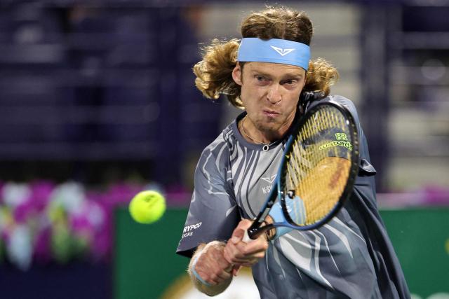Russia’s Andrey Rublev returns a shot during his men’s singles semi-final match against the Netherlands' Tallon Griekspoor at the Dubai Duty Free Tennis tournament in Dubai on February 27, 2026. (Photo by Fadel SENNA / AFP)