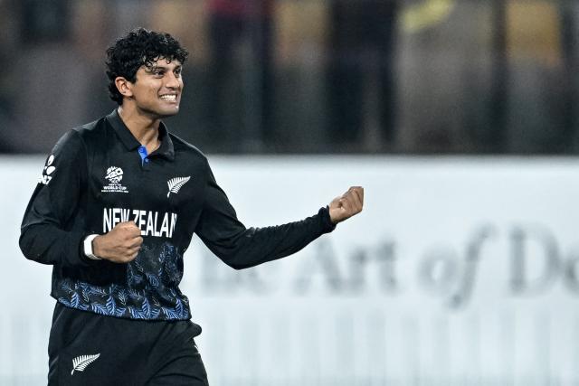 New Zealand's Rachin Ravindra celebrates after taking the wicket of England's Sam Curran during the 2026 ICC Men's T20 Cricket World Cup Super Eights match between England and New Zealand at the R Premadasa Stadium in Colombo on February 27, 2026. (Photo by R. Satish BABU / AFP)
