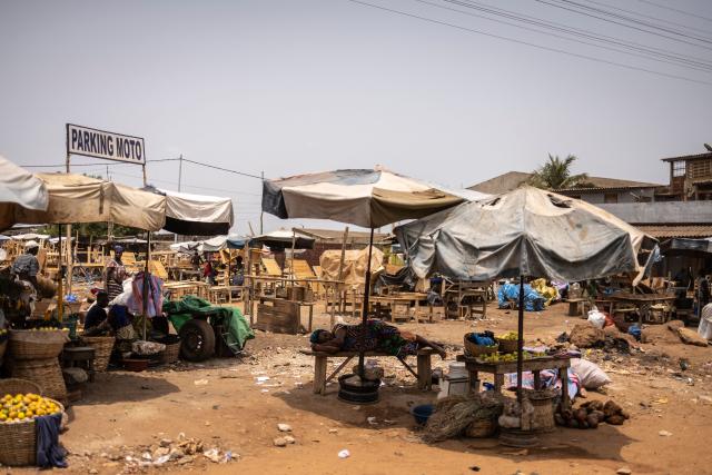 A vendor sleeps on her stall in the Akodessewa market in Lome, on February 27, 2026. (Photo by OLYMPIA DE MAISMONT / AFP)