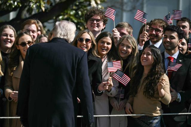 US President Donald Trump stops and greets guests on the South Lawn of the White House on his way to board Marine One as he departs for Texas in Washington, DC, on February 27, 2026. President Trump is traveling to Corpus Christi, Texas, to deliver remarks on energy. (Photo by ANDREW CABALLERO-REYNOLDS / AFP)