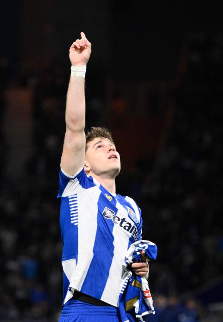 FC Porto's Polish midfielder #77 Oskar Pietuszewski celebrates scoring the opening goal during the Portuguese League football match between FC Porto and FC Arouca at Dragao stadium in Porto, on February 27, 2026. (Photo by Miguel RIOPA / AFP)