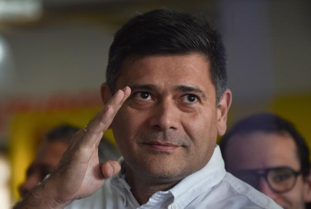 (FILES) The political coordinator of the opposition party Voluntad Popular (Popular Will), Freddy Superlano, gestures as he offers a press conference to announce the candidacy of opposition politician Juan Guiado for the 2023 primary elections, in Caracas on March 7, 2023. Opposition leader Freddy Superlano, known for winning the governorship of Barinas, the hometown of late Venezuelan President Hugo Chavez, was granted full freedom under Venezuelas amnesty law, the opposition figure said on February 27, 2026. (Photo by Miguel ZAMBRANO / AFP)