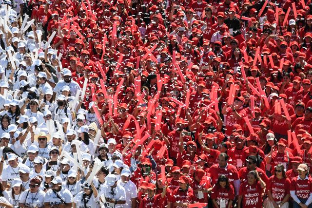 Football fans take part in forming a mosaic of a jersey in Mexicos flag colors that aims to be the largest in the world and enter the Guinness Book of Records, with about five thousand people, in Tuxtla Gutierrez, Chiapas state, Mexico, on February 27, 2026. (Photo by Isaac GUZMAN / AFP)