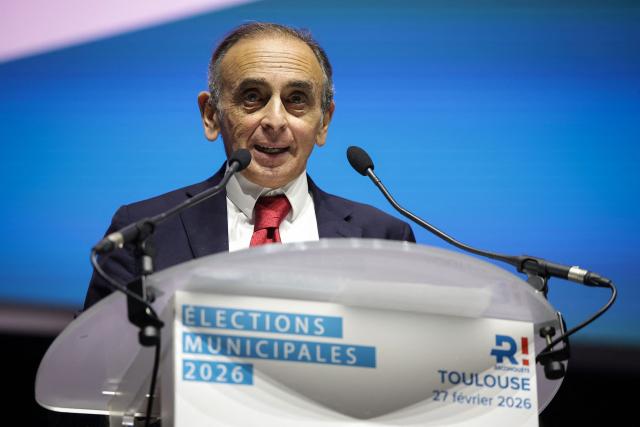 French far-right Reconquete! party leader Eric Zemmour gives a speech during a campaign meeting of the Reconquete! Toulouse mayoral candidate in Toulouse, southwestern France, on February 27, 2026. French voters head to the polls for municipal elections on March 15 and 22, 2026. (Photo by Valentine CHAPUIS / AFP)