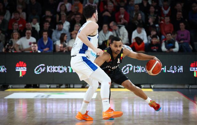Finland's Mustapha Amzil (L) and Belgium's Stephan Swenson Dibongue fight for the ball during the men's FIBA Basketball World Cup 2027 European qualification match between Belgium and Finland at the Dome Charleroi in Charleroi on February 27, 2026. (Photo by VIRGINIE LEFOUR / Belga / AFP) / Belgium OUT