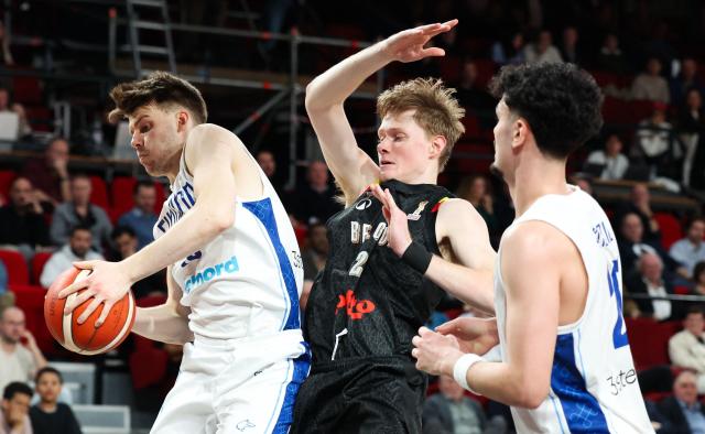 Finland's Perttu Blomgren (L) and Belgium's Siebe Ledegen (C) fight for the ball during the men's FIBA Basketball World Cup 2027 European qualification match between Belgium and Finland at the Dome Charleroi in Charleroi on February 27, 2026. (Photo by VIRGINIE LEFOUR / Belga / AFP) / Belgium OUT