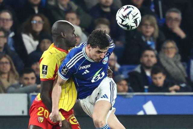 Strasbourg’s Argentine forward #09 Joaquin Panichelli (R) fights for the ball with Lens’ French defender #20 Malang Sarr during the French L1 football match between RC Strasbourg Alsace and Lens (RCL) at the Stade de la Meinau in Strasbourg, eastern France, on February 27, 2026. (Photo by Frederick FLORIN / AFP)
