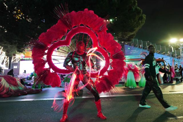 An artist performs during the "Lou Queernaval", the first gay carnival in France as part of the Nice carnival, southeastern France, on February 27, 2026. The edition 2026 of the Nice Carnival, whose theme is "Long live the Queen", takes place until March 1, 2026. (Photo by Valery HACHE / AFP)