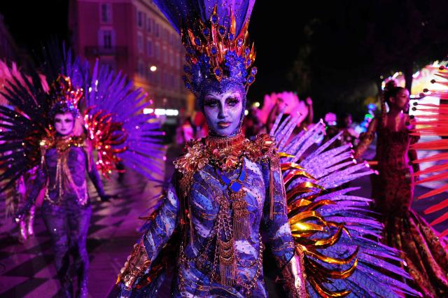 An artist performs during the "Lou Queernaval", the first gay carnival in France as part of the Nice carnival, southeastern France, on February 27, 2026. The edition 2026 of the Nice Carnival, whose theme is "Long live the Queen", takes place until March 1, 2026. (Photo by Valery HACHE / AFP)