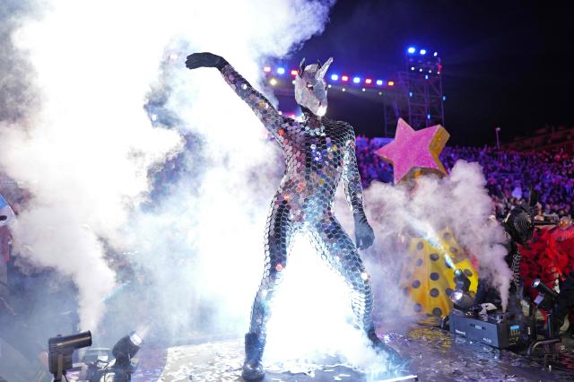 An artist performs during the "Lou Queernaval", the first gay carnival in France as part of the Nice carnival, southeastern France, on February 27, 2026. The edition 2026 of the Nice Carnival, whose theme is "Long live the Queen", takes place until March 1, 2026. (Photo by Valery HACHE / AFP)