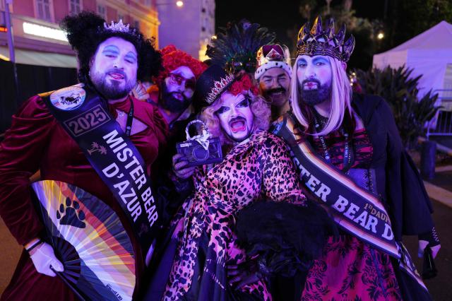 Participants pose during the "Lou Queernaval", the first gay carnival in France as part of the Nice carnival, southeastern France, on February 27, 2026. The edition 2026 of the Nice Carnival, whose theme is "Long live the Queen", takes place until March 1, 2026. (Photo by Valery HACHE / AFP)