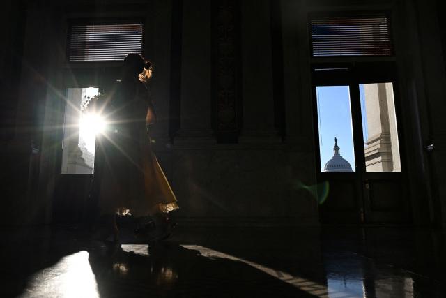 The US Capitol is seen through a window in Washington, DC, on February 27, 2026. (Photo by Alex WROBLEWSKI / AFP)