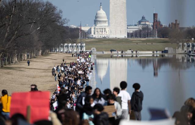 Washington DC high school students rally at an "End ICE brutality" protest by the Lincoln Memorial in Washington, DC, on February 27, 2026. (Photo by ANDREW CABALLERO-REYNOLDS / AFP)
