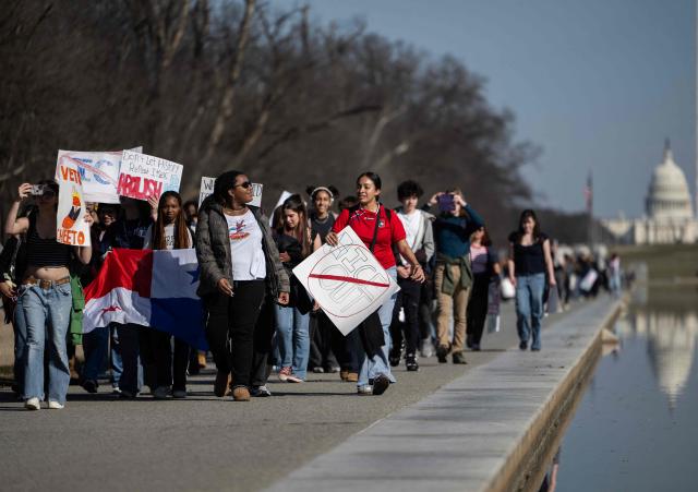 Washington DC high school students rally at an "End ICE brutality" protest by the Lincoln Memorial in Washington, DC, on February 27, 2026. (Photo by ANDREW CABALLERO-REYNOLDS / AFP)