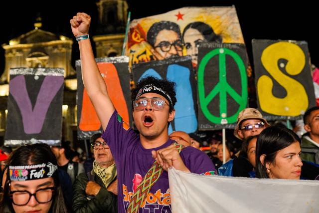 A supporter of Colombian presidential candidate Ivan Cepeda from the leftist ruling party Pacto Historico shouts slogans during a campaign rally at Bolivar Square in Bogota on February 27, 2026. Colombia will hold a legislative elections on March 8 and the first round of presidential elections on May 31, 2026. (Photo by Sergio Yate / AFP)