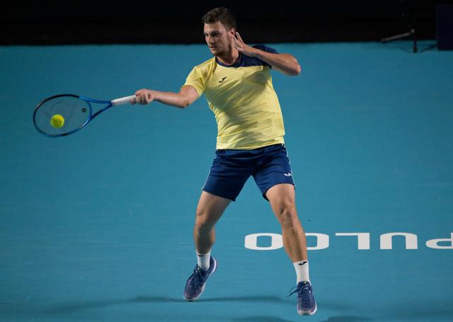 Serbian Miomir Kecmanovic returns to Italy's Flavio Cobolli during the 2026 Mexico ATP 500 Tennis Open men's singles tennis semi-final match at the Arena GNP Seguros in Acapulco, Guerrero State, Mexico on February 27, 2026. (Photo by Alfredo ESTRELLA / AFP)