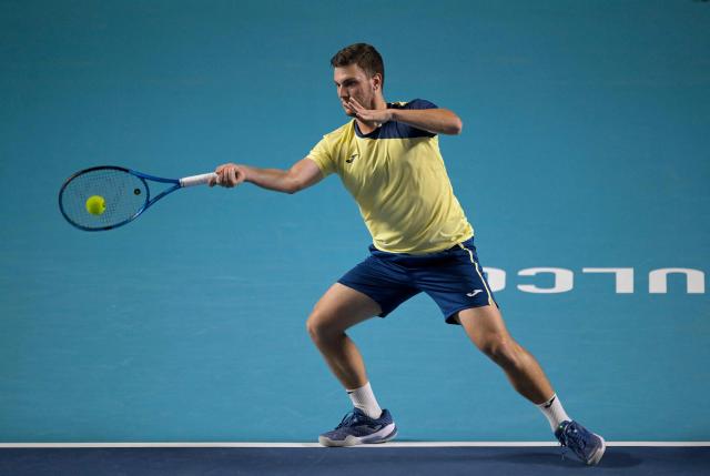 Serbian Miomir Kecmanovic returns to Italy's Flavio Cobolli during the 2026 Mexico ATP 500 Tennis Open men's singles tennis semi-final match at the Arena GNP Seguros in Acapulco, Guerrero State, Mexico on February 27, 2026. (Photo by Alfredo ESTRELLA / AFP)