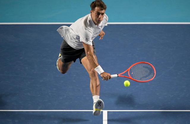 Italy's Flavio Cobolli returns to Serbian Miomir Kecmanovic during the 2026 Mexico ATP 500 Tennis Open men's singles tennis semi-final match at the Arena GNP Seguros in Acapulco, Guerrero State, Mexico on February 27, 2026. (Photo by Alfredo ESTRELLA / AFP)