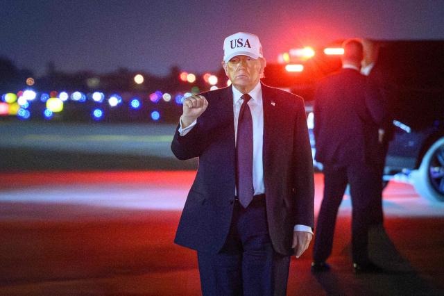 US President Donald Trump gestures as he arrives at Palm Beach International Airport in West Palm Beach, Florida on February 27, 2026. Trump is spending the weekend at his Mar-a-Lago resort. (Photo by Mandel NGAN / AFP)