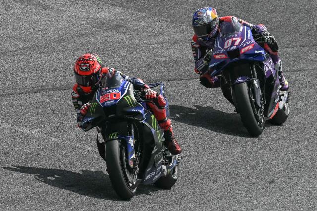Monster Energy Yamaha's French rider Fabio Quartararo (L) rides in front of Prima Pramac Yamaha's Turkish rider Toprak Razgatlioglu during the qualifying session of the MotoGP Thailand Grand Prix at the Buriram International Circuit in Buriram on February 28, 2026. (Photo by Lillian SUWANRUMPHA / AFP)