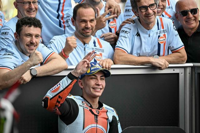 Third-placed Trackhouse MotoGP's Spanish rider Raul Fernandez celebrates with his team after the qualifying session of the MotoGP Thailand Grand Prix at the Buriram International Circuit in Buriram on February 28, 2026. (Photo by Lillian SUWANRUMPHA / AFP)