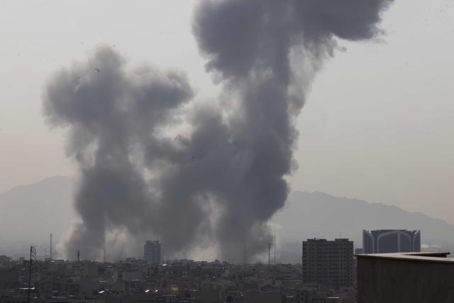 A plume of smoke rises following a reported explosion in Tehran on February 28, 2026. Two loud blasts were heard in Tehran on February 28 morning by AFP journalists, and two plumes of thick smoke were seen over the centre and east of the Iranian capital. Israel's defence ministry announced it had launched a "preemptive strike" on Iran as sirens sounded in Jerusalem and people across the country received phone alerts about an "extremely serious" threat. (Photo by ATTA KENARE / AFP)