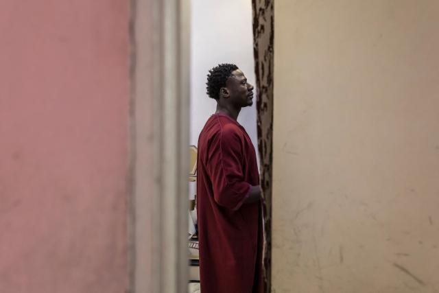 Doudou Sene gets ready for the Friday prayer during the holy month of Ramadan in Dakar, on February 27, 2026. What started as small workouts in one of the many outdoor gyms that proliferate in Dakar slowly turned into a passion for Doudou Sene. People kept telling him that he had potential in the world of fitness, and in 2019 he began to train seriously. In 2021, he participated in his first powerlifting competition in Dakar and finished first in the under?83 kg category. Soon after, he traveled to The Gambia for another competition, where he finished third. After succeeding as a powerlifter, he decided to switch to bodybuilding, a little?known sport in Senegal with few role models, such as Sidy Pouye, who has managed to build a successful career abroad as a bodybuilder. People dont know much about the sport, but that doesnt stop Doudou from following his passion. During the holy month of Ramadan, training and maintaining a proper diet become challenging. Doudou normally eats five to six meals a day to maintain his gains, but during Ramadan this is reduced to two or three. He prefers to train at the gym where he works right before breaking the fast, and then stays late to help clients with their workouts. Family and religion are his driving forces as he continues pushing himself, even during Ramadan, to achieve his goal of making a living as a bodybuilder and providing for his family. (Photo by PATRICK MEINHARDT / AFP)