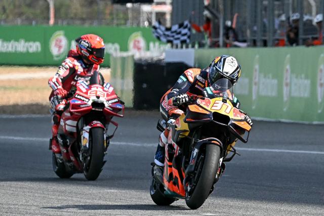 Red Bull KTM Factory Racing's Spanish rider Pedro Acosta (R) rides in front of Ducati Lenovo Team's Spanish rider Marc Marquez to win the sprint race of the MotoGP Thailand Grand Prix at the Buriram International Circuit in Buriram on February 28, 2026. (Photo by Lillian SUWANRUMPHA / AFP)