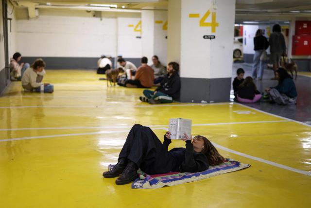 People take shelter in Tel Aviv on February 28, 2026. The Israeli military said its strikes on Iran, in coordination with the United States, targeted dozens of military sites and followed months of joint planning between the allies. (Photo by Ilia YEFIMOVICH / AFP)