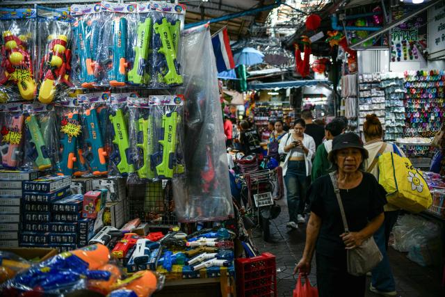Visitors walk through an alley at Sampheng Market in Bangkok on February 28, 2026. (Photo by Amaury PAUL / AFP)